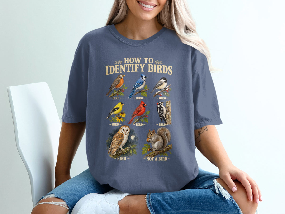 "How to Identify Birds" graphic tee with illustrations of various birds and a squirrel.