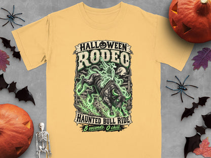 Yellow t-shirt with "Halloween Rodeo Haunted Bull Ride" graphic and spooky elements.
