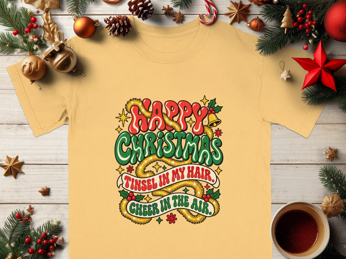 Yellow t-shirt with "Happy Christmas Tinsel in my hair, Cheer in the air." text.