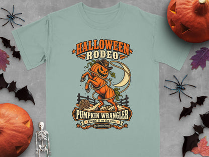 Light blue t-shirt with "Halloween Rodeo Pumpkin Wrangler" text and pumpkin horse graphic.