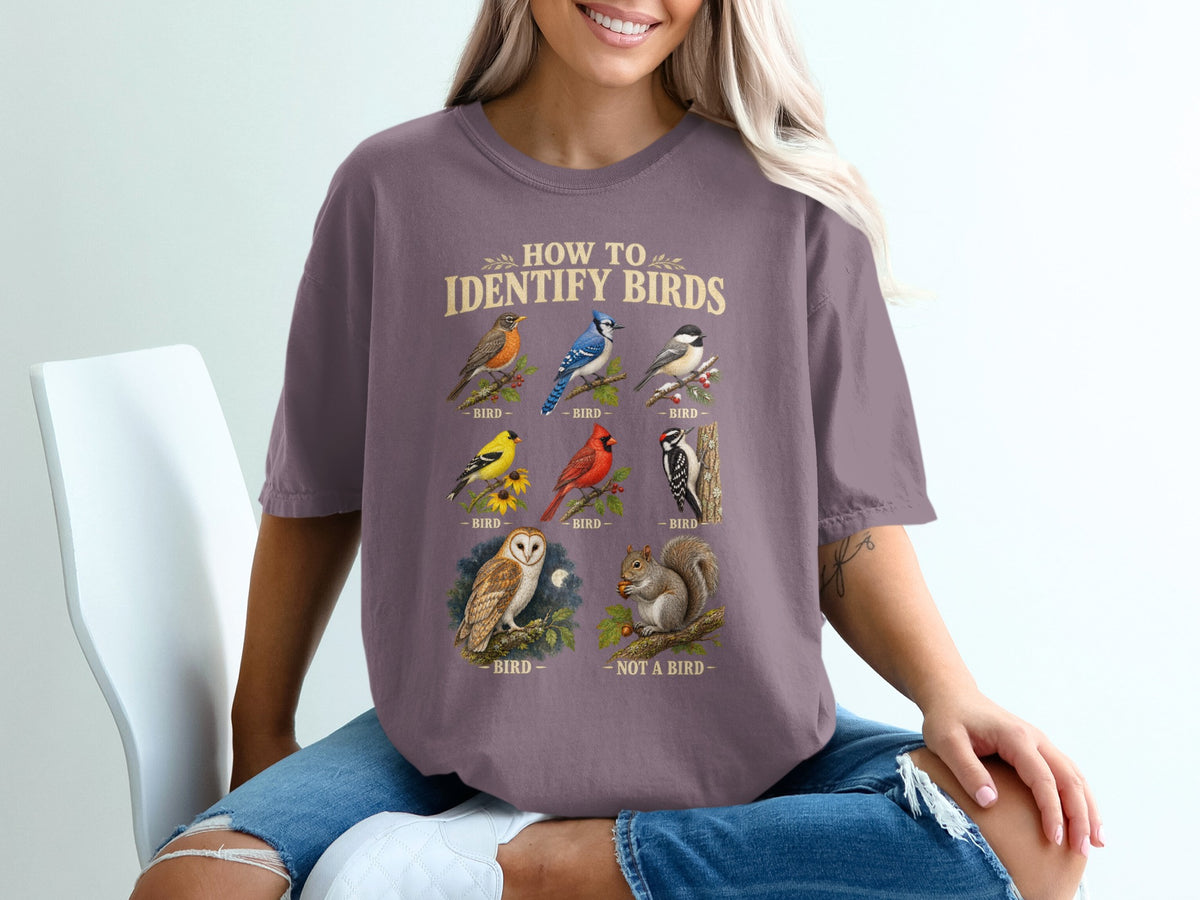 "How to Identify Birds" graphic on a shirt showing various birds and a squirrel.