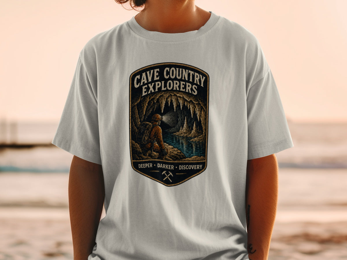 T-shirt with "Cave Country Explorers Deeper Darker Discovery" text and cave graphic.
