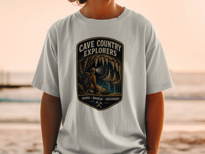 T-shirt with "Cave Country Explorers Deeper Darker Discovery" text and cave graphic.