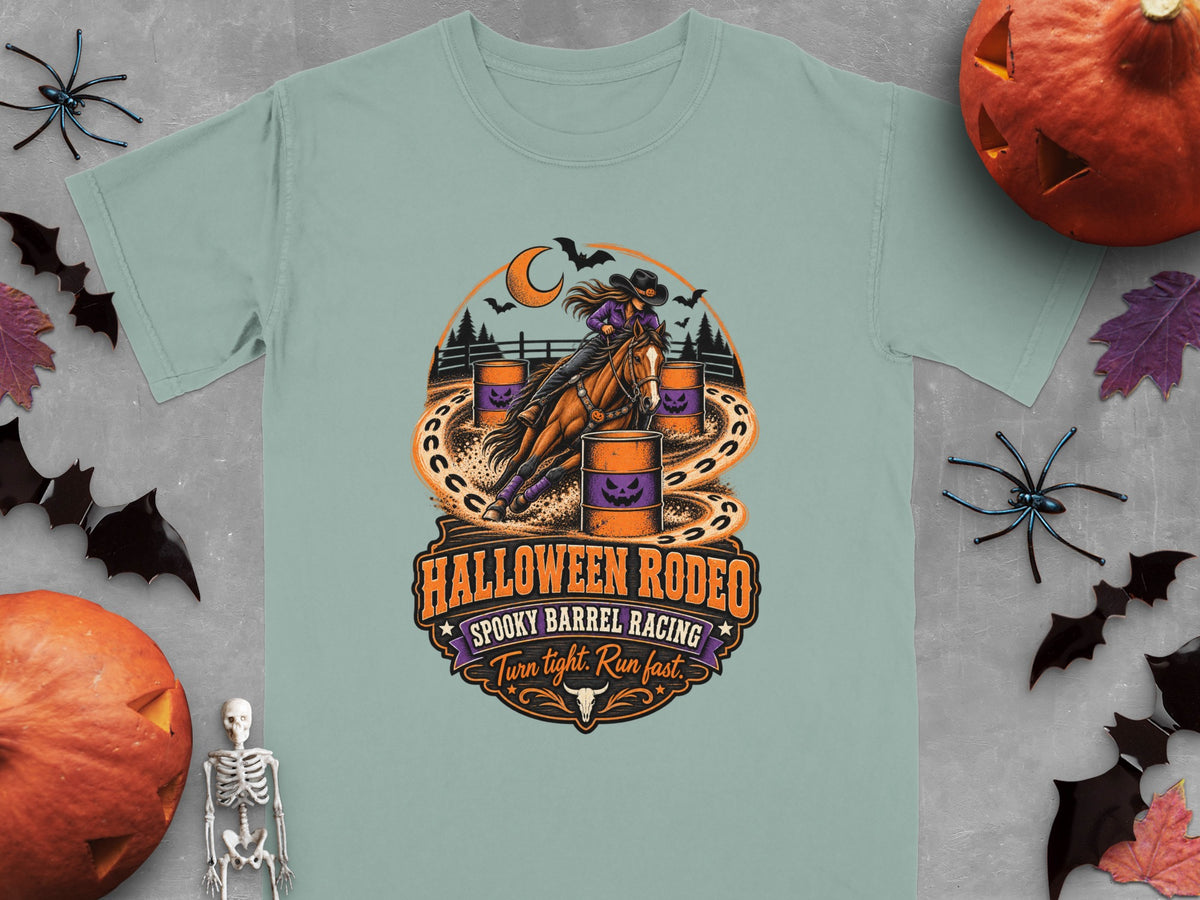 T-shirt graphic: Woman barrel racing a horse with Halloween rodeo text.