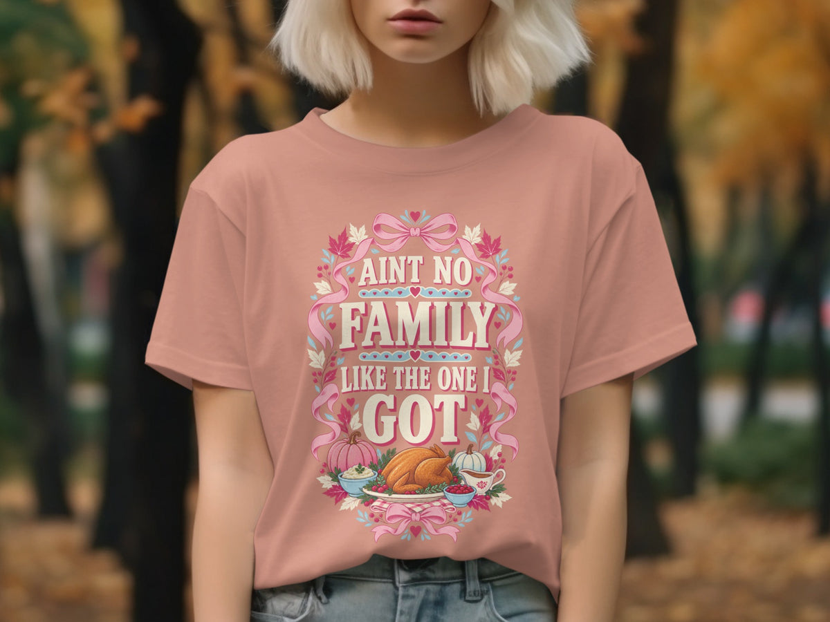 Peach t-shirt with text "AINT NO FAMILY LIKE THE ONE I GOT" and Thanksgiving graphics.