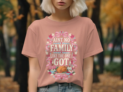 Peach t-shirt with text "AINT NO FAMILY LIKE THE ONE I GOT" and Thanksgiving graphics.