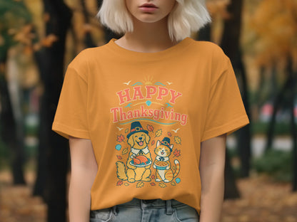 Orange t-shirt with a dog holding turkey and cat holding pie, saying "Happy Thanksgiving".