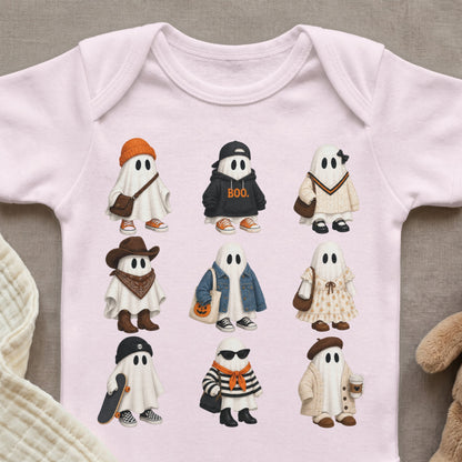Nine cute ghosts dressed in various outfits and accessories, displayed on a pink baby onesie.