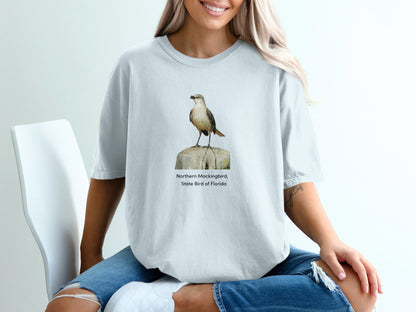 Northern Mockingbird, State Bird of Florida graphic on a light blue t-shirt.