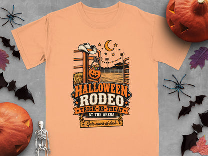 Orange t-shirt with Halloween Rodeo Trick-or-Treat graphic featuring a pumpkin basket.