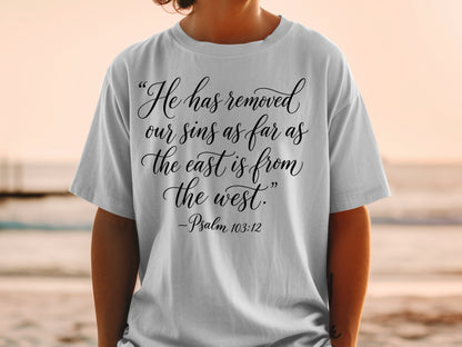 Gray t-shirt with "He has removed our sins as far as the east is from the west. -Psalm 103:12"