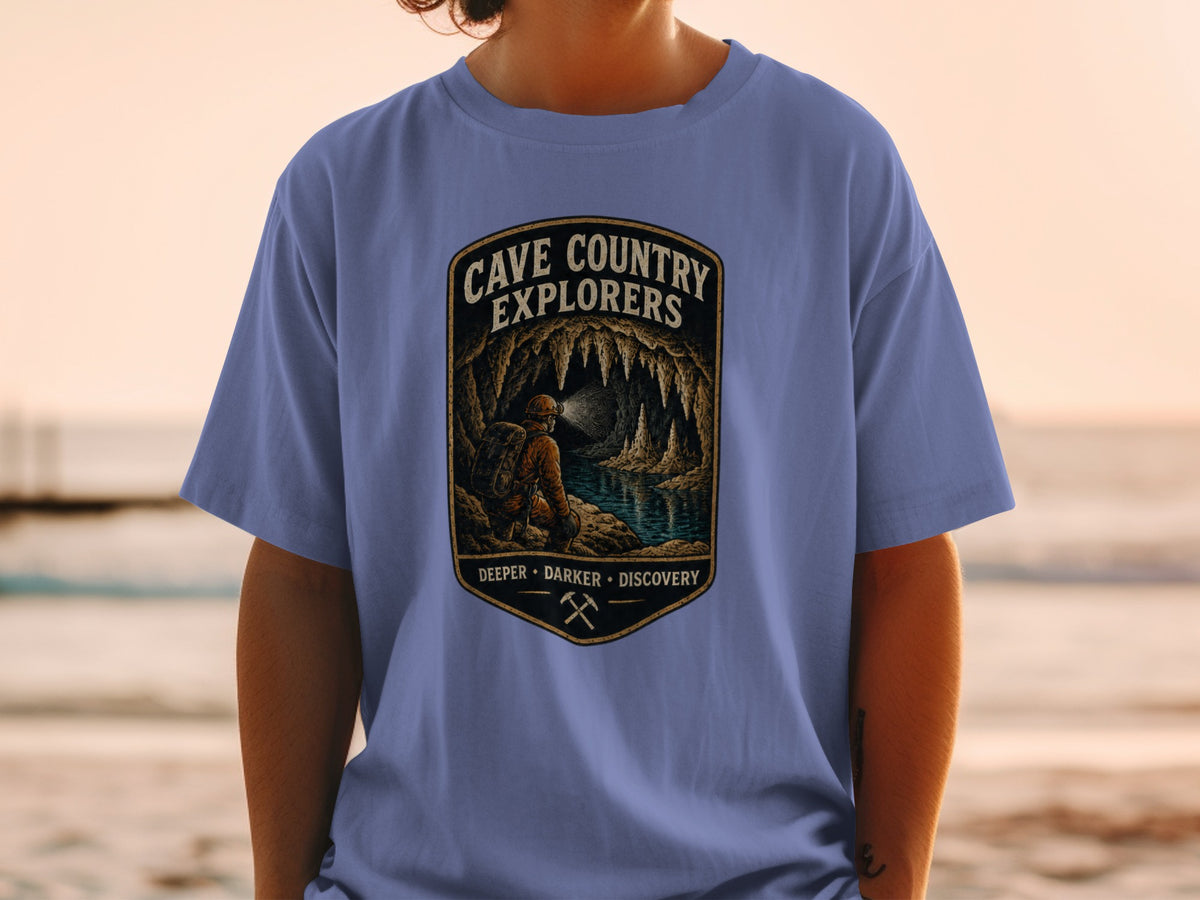 Cave Country Explorers graphic tee with caver exploring a cave with stalactites.
