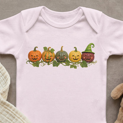 Pink baby onesie with five cartoon pumpkins and leaves graphic.