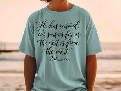 T-shirt with Psalm 103:12 scripture in black script font.