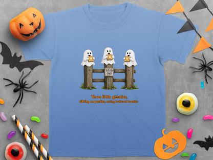 Light blue t-shirt with three ghosts sitting on a fence eating toast.
