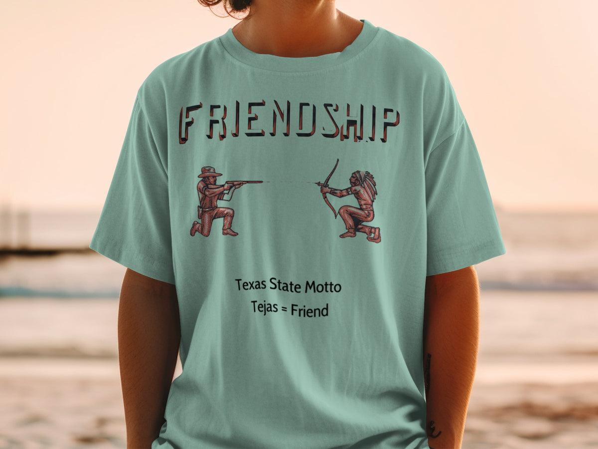 Tejas = Friend Texas State Motto on a teal t-shirt with a friendship graphic.