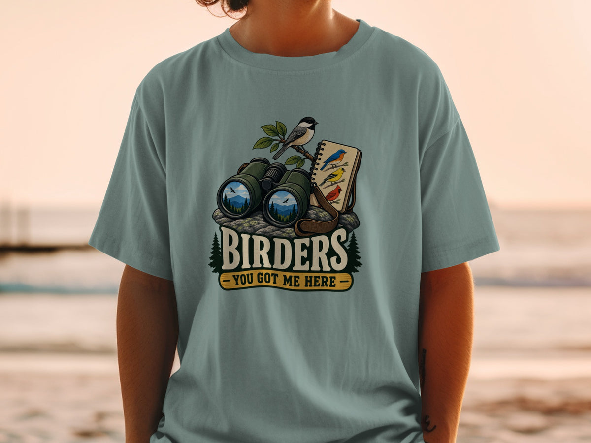 Birders graphic with binoculars, bird, and notebook, reading "Birders - You Got Me Here."