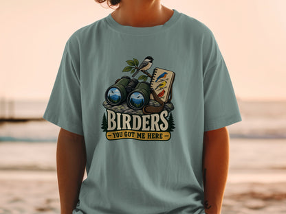 Birders graphic with binoculars, bird, and notebook, reading "Birders - You Got Me Here."