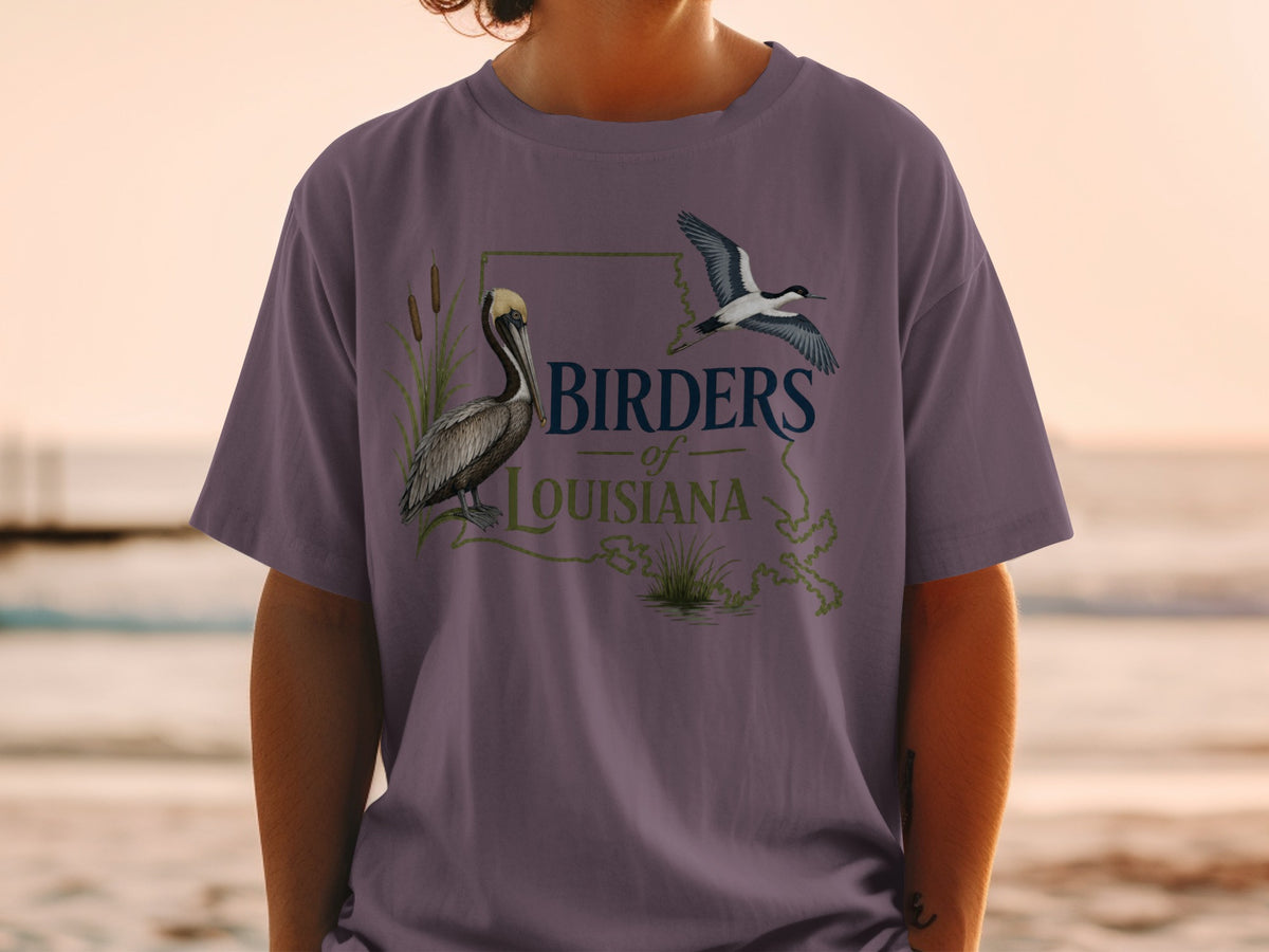 T-shirt graphic: pelican and bird over Louisiana map with text "Birders of Louisiana".