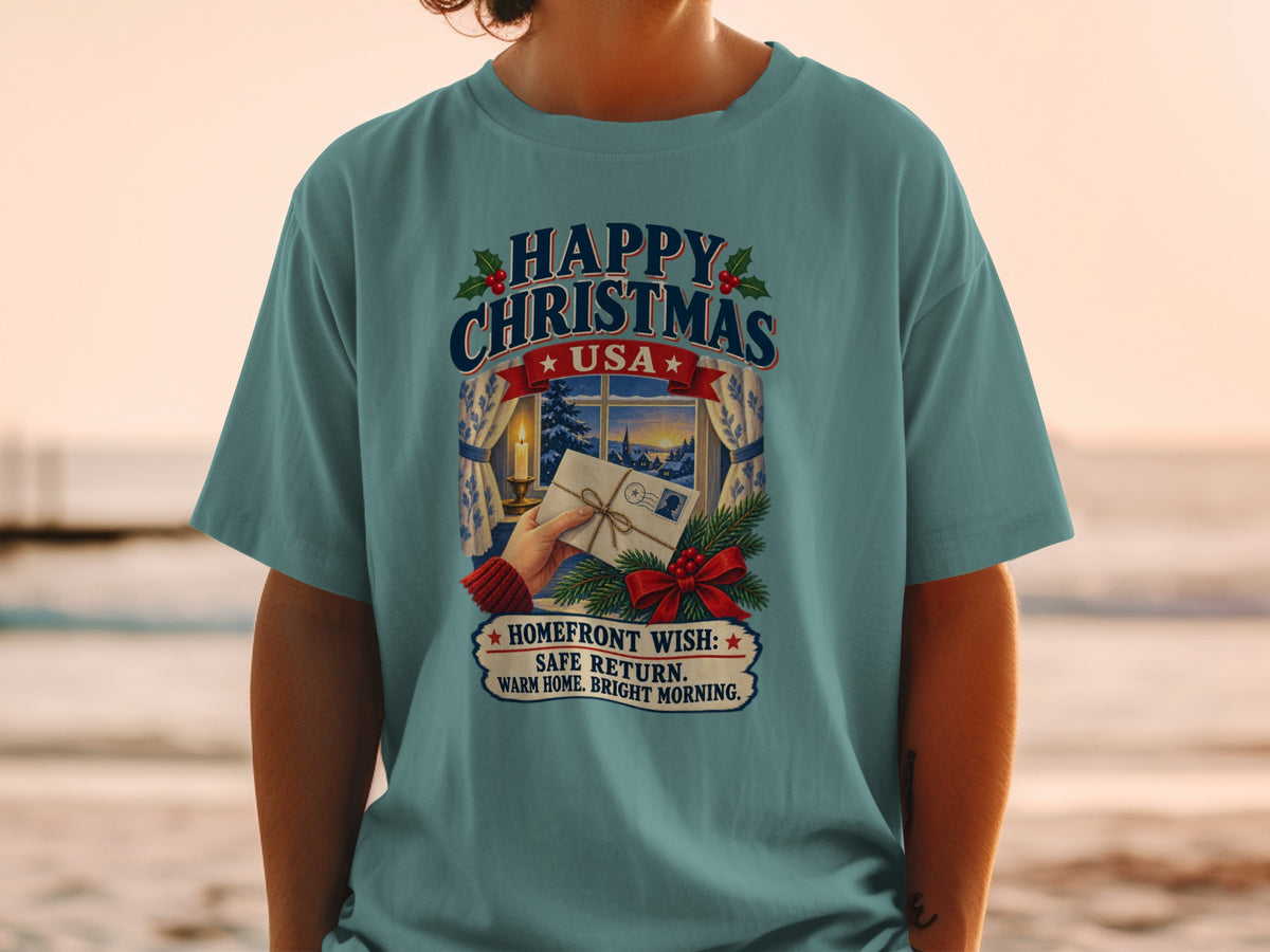 T-shirt graphic: "Happy Christmas USA" with window scene and homefront wish.