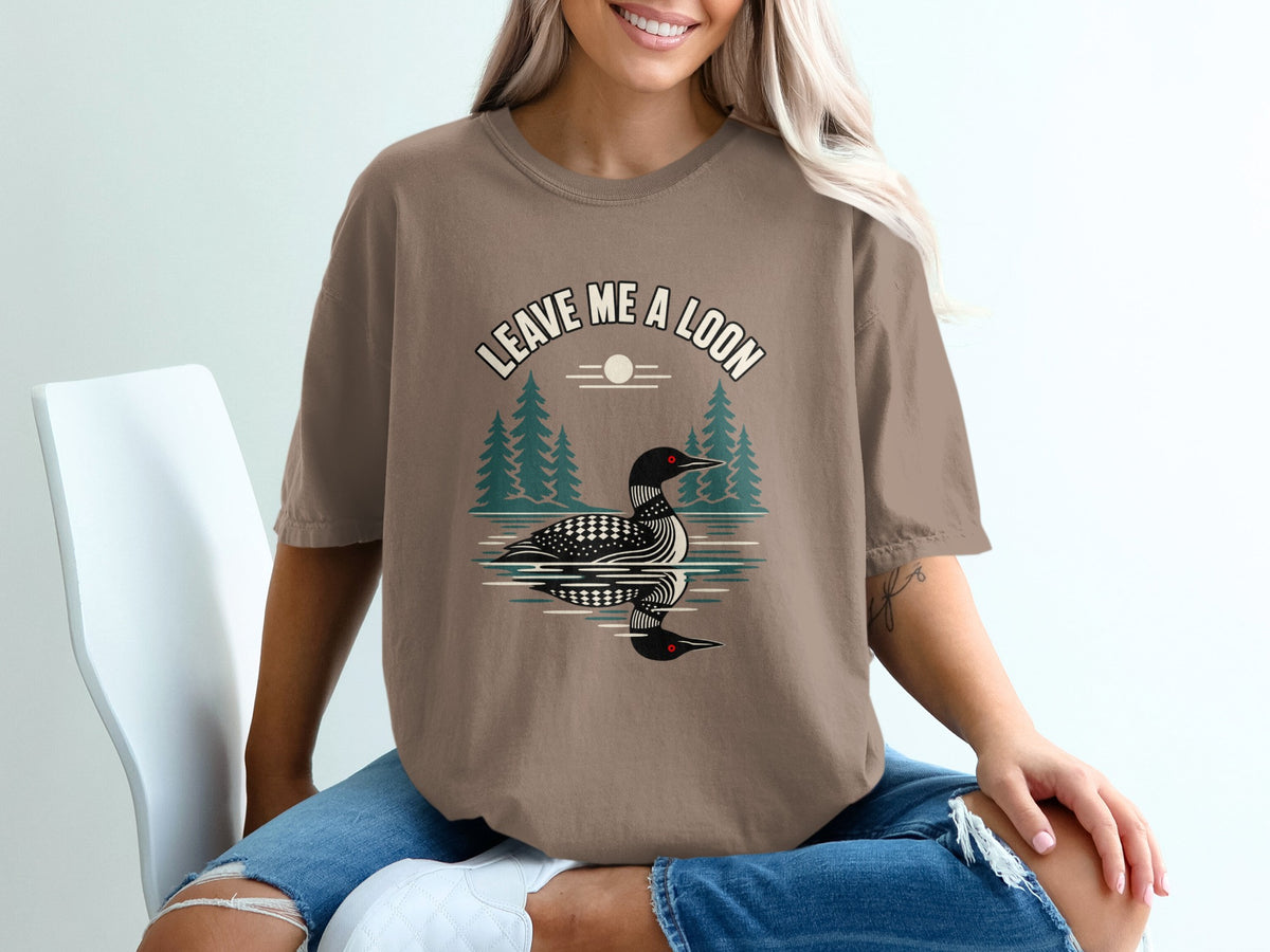 Brown t-shirt with a loon graphic and the text "LEAVE ME A LOON."