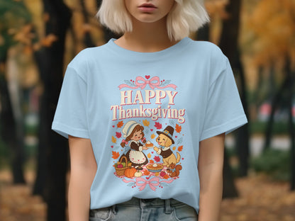 Light blue t-shirt with a Thanksgiving graphic featuring a girl, dog, pie, and pumpkins.