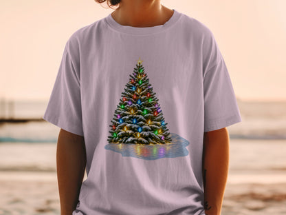 Christmas tree with colorful lights and snow on a pink t-shirt.