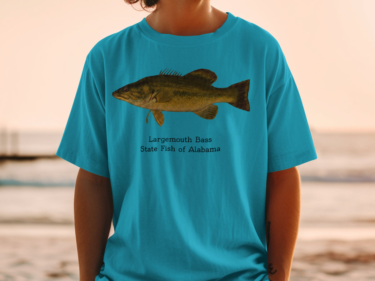 Largemouth Bass, State Fish of Alabama graphic on a teal t-shirt.