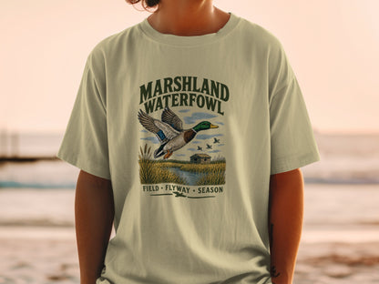 T-shirt with "MARSHLAND WATERFOWL" text and flying duck illustration.