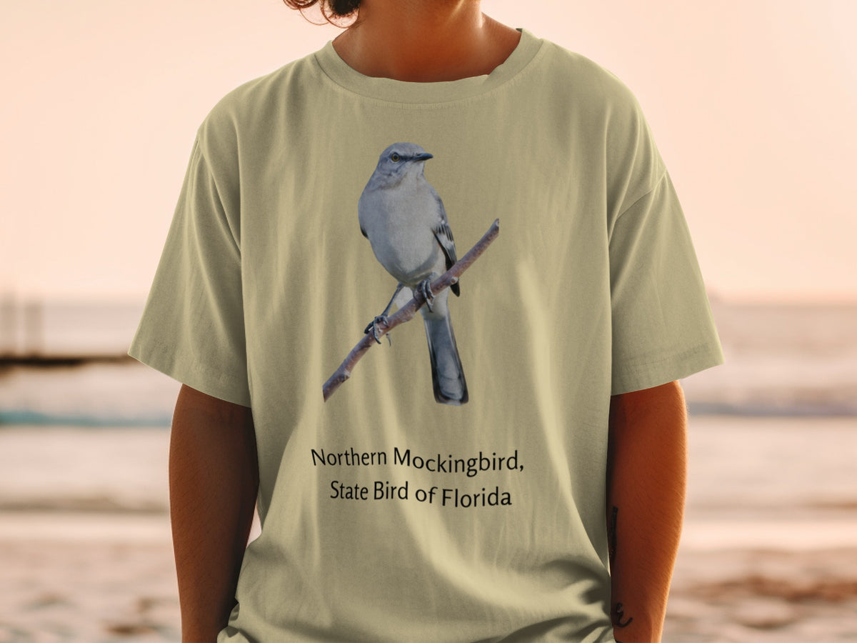 Northern Mockingbird, State Bird of Florida graphic on a tan t-shirt.