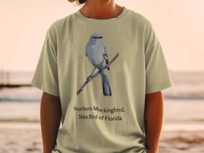Northern Mockingbird, State Bird of Florida graphic on a tan t-shirt.