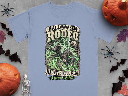 T-shirt graphic: "Halloween Rodeo Haunted Bull Ride" with a skeleton cowboy and glowing bull.