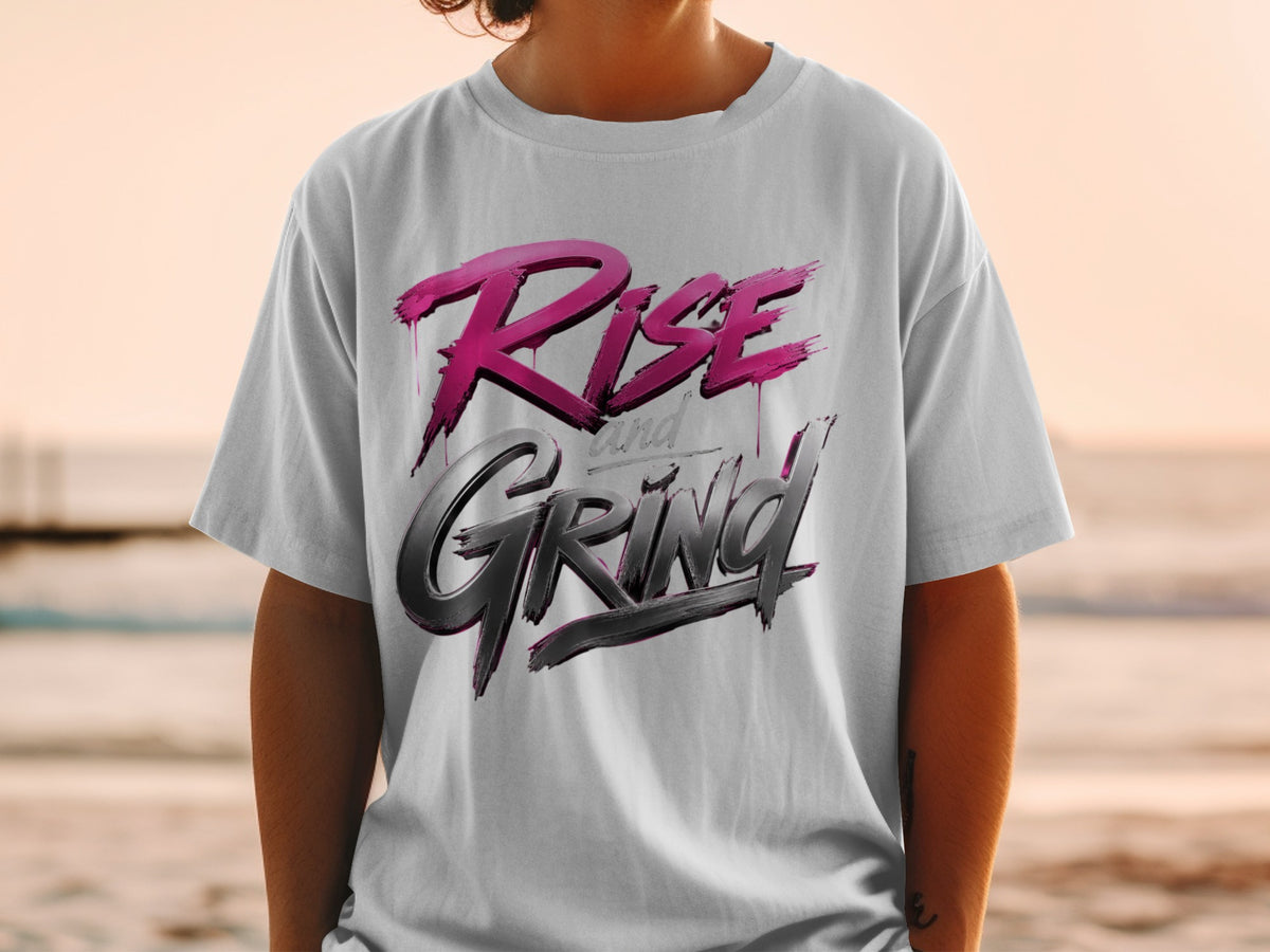 White t-shirt with "Rise and Grind" text in pink and black lettering