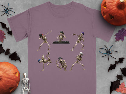 Six dancing skeletons, one DJing, on a purple t-shirt.