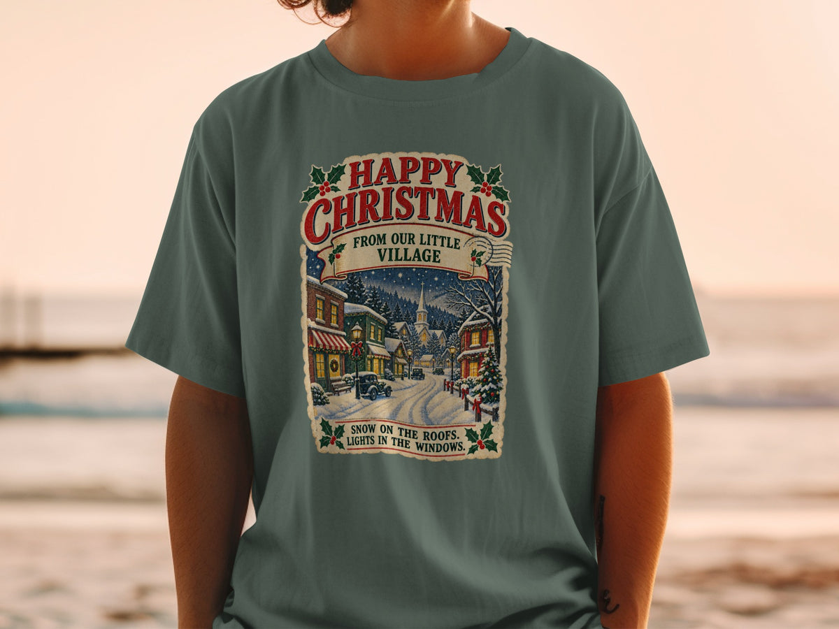T-shirt with "Happy Christmas From Our Little Village" and a snowy village scene.