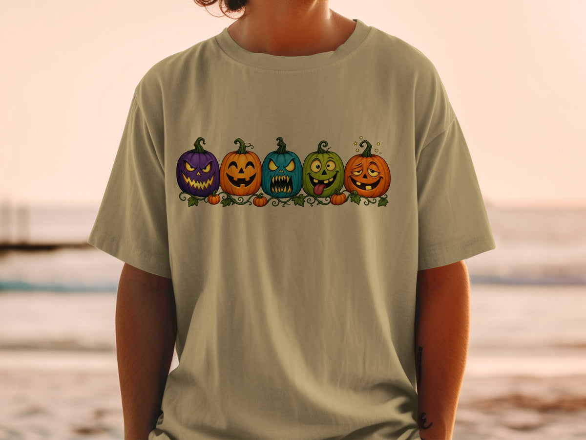 Row of five cartoon jack-o'-lanterns with different spooky expressions.