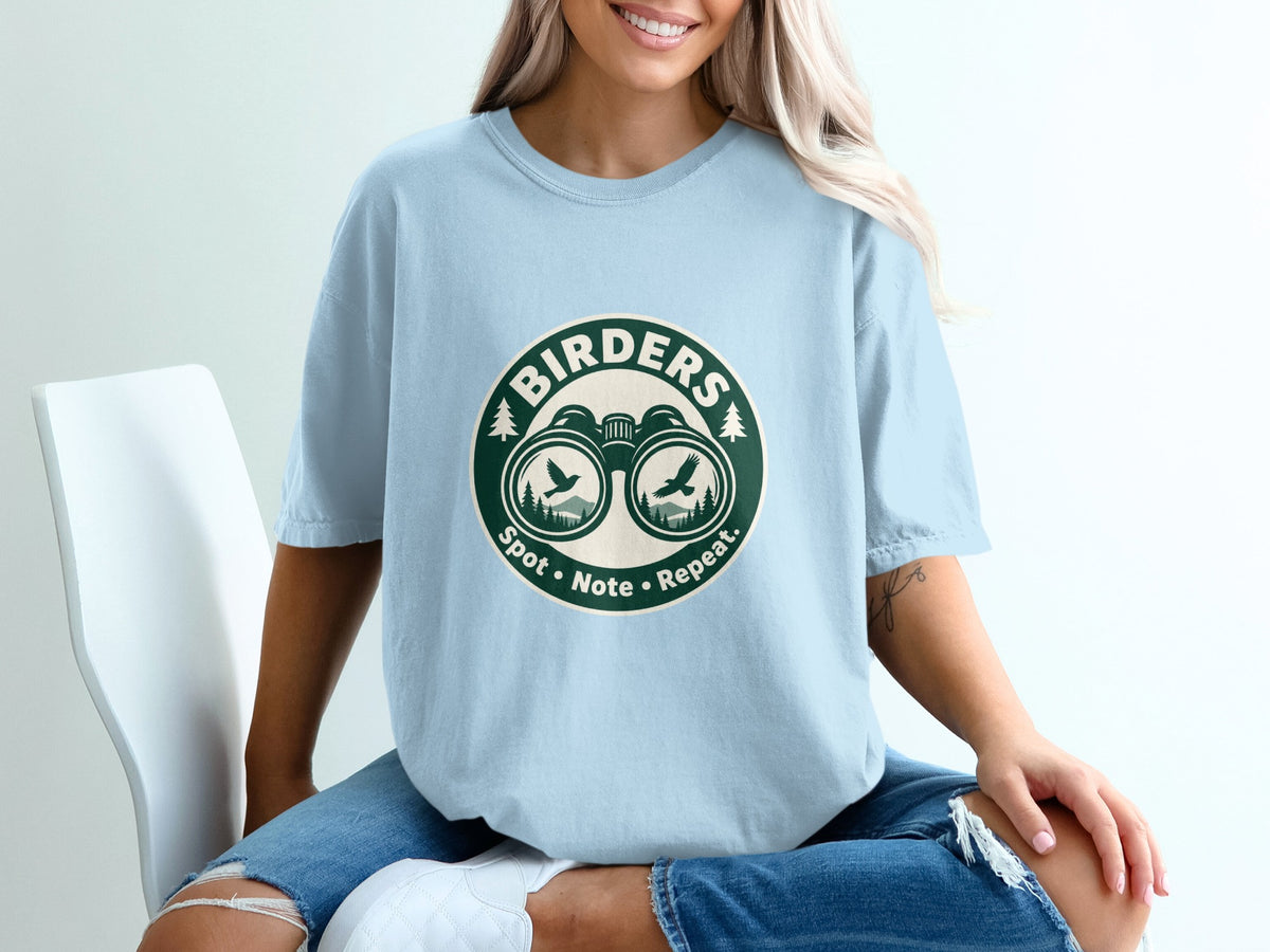 Light blue t-shirt with "Birders Spot Note Repeat" graphic on front.