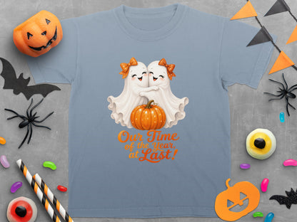 T-shirt with two ghosts hugging by a pumpkin, saying "Our Time of the Year, at Last!".