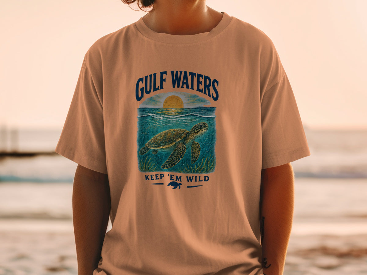 T-shirt with "Gulf Waters Keep 'Em Wild" text and sea turtle graphic.