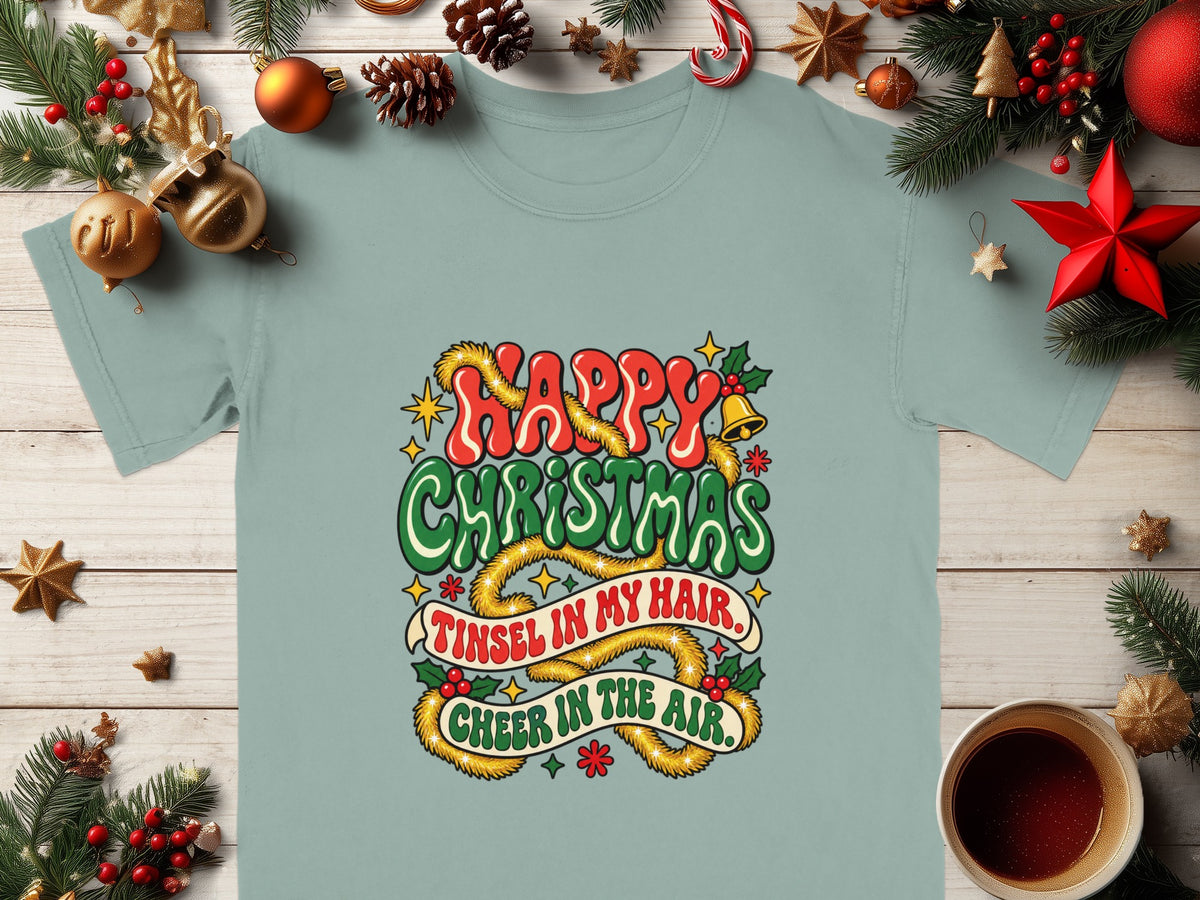 T-shirt with "Happy Christmas" and "Tinsel in my hair, Cheer in the air" text.