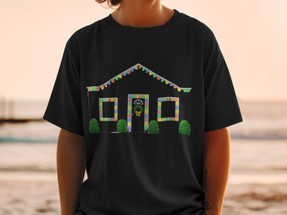 Black t-shirt with a house decorated in Christmas lights and a wreath.