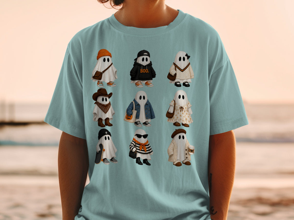 Nine illustrated ghosts in fashionable outfits on a light blue t-shirt.