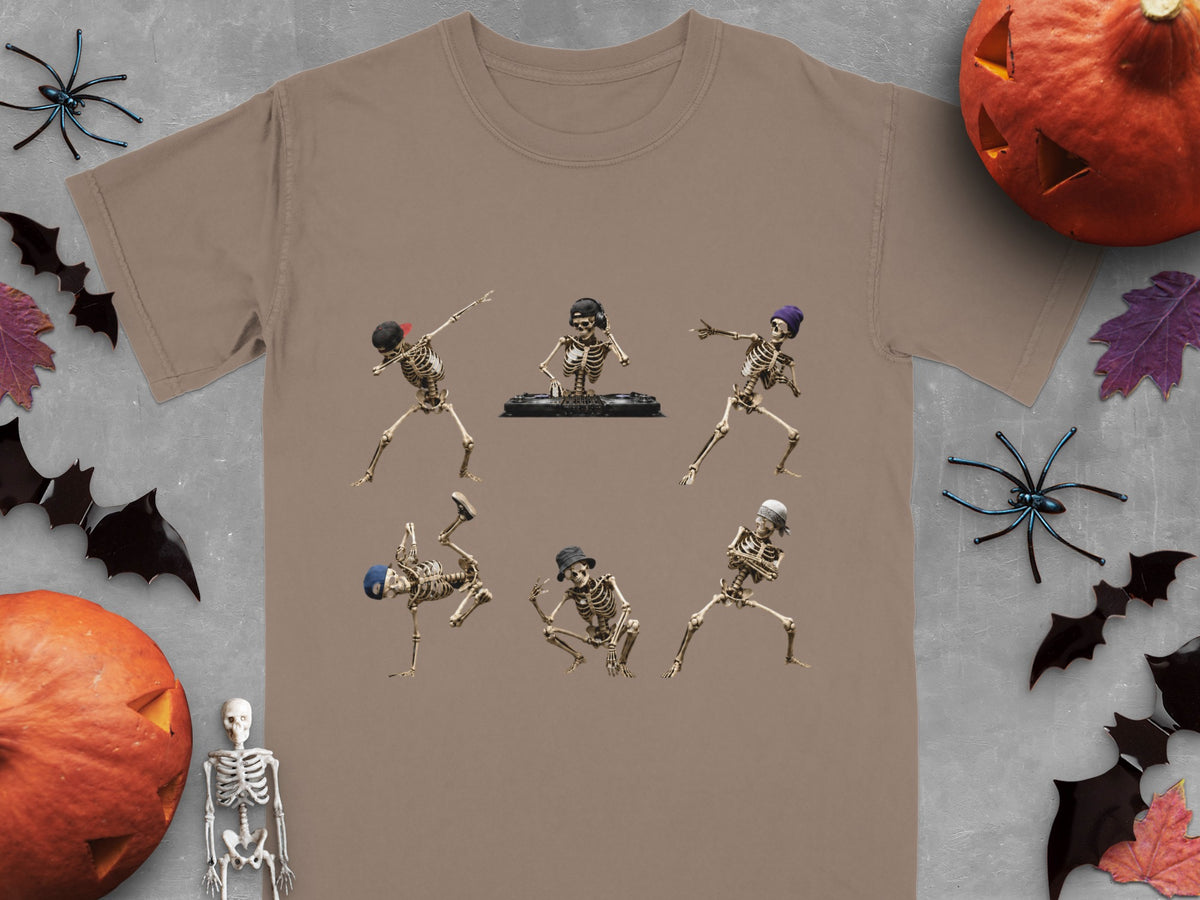 Six skeletons in dancing poses with hats and a DJ setup on a taupe t-shirt.