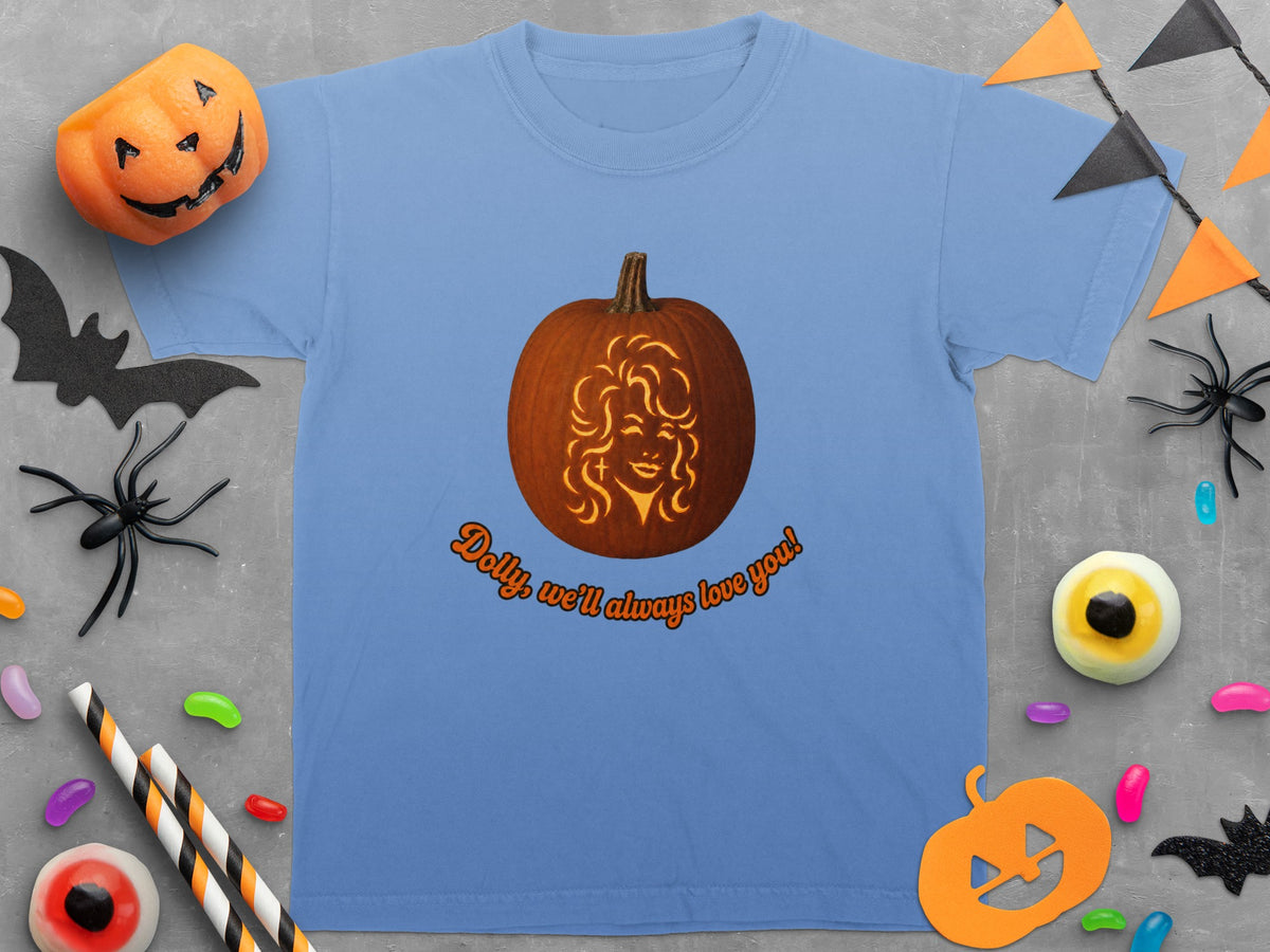 Light blue t-shirt with carved pumpkin graphic and "Dolly, we'll always love you!" text.