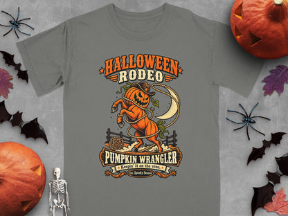 Gray t-shirt featuring "Halloween Rodeo Pumpkin Wrangler" graphic with a lassoed pumpkin horse.
