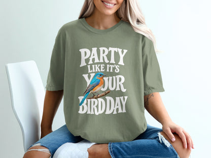 Green t-shirt with text "Party Like It's Your Bird Day" and a blue bird.