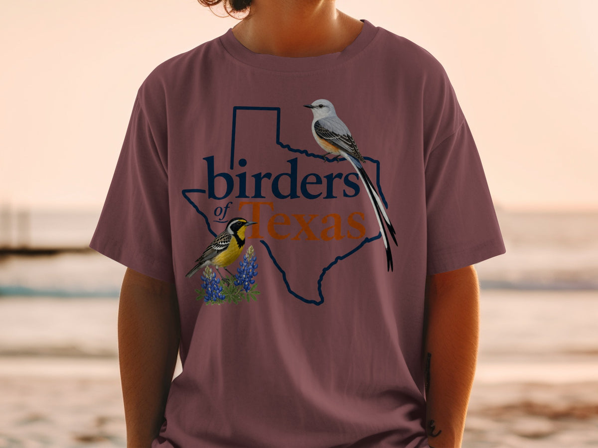 Maroon t-shirt with "birders of Texas" text and two bird illustrations.