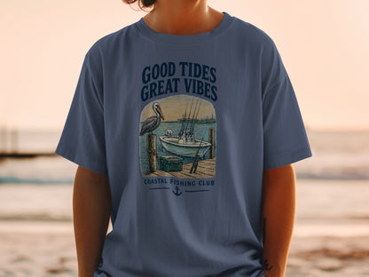 T-shirt graphic with text "GOOD TIDES GREAT VIBES" and fishing scene.