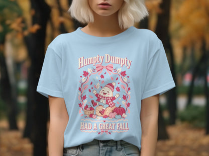 Light blue t-shirt with "Humpty Dumpty HAD A GREAT FALL" and autumn graphics.