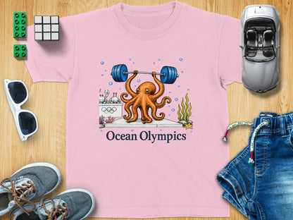 Pink t-shirt with octopus lifting barbell, "Ocean Olympics" text.